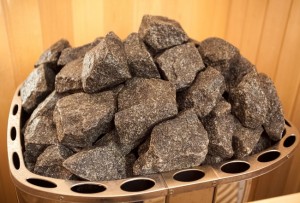Closeup photo of granite rocks on oven at sauna